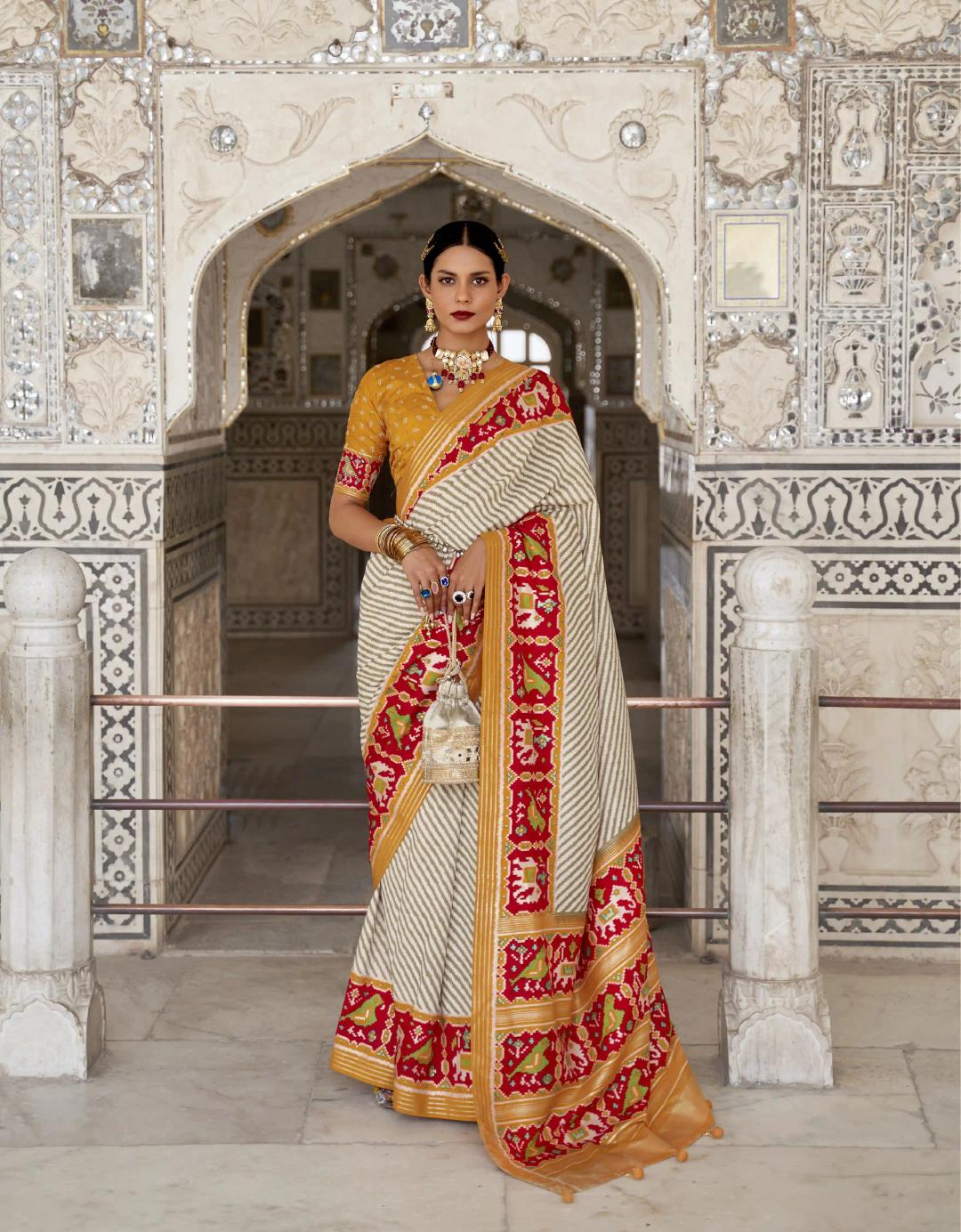 Soft Silk Patola Print White Striped Saree With Orange Border